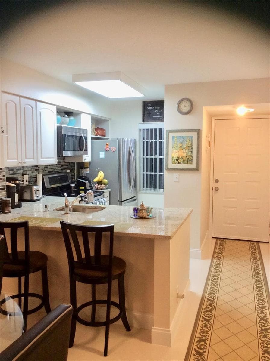 2220 N Cypress Bend Drive # 104, Pompano Beach, FL 33069 photo 11